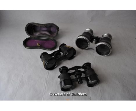Three pairs of vintage opera glasses.