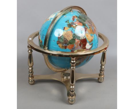 A 360 degree revolving globe on stand with built in compass to base.