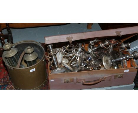 A vintage travel trunk and brass bucket with contents of various metalwares to include candelabra, kettles, pierced tazza etc