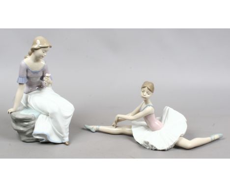 Two Nao porcelain figures of ladies one formed as a ballet dancer the other seated holding a flower.