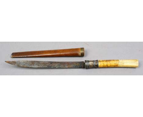 An ivory handled eastern dagger in wooden scabbard (AF).