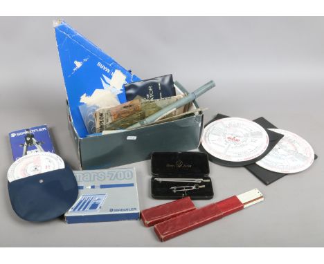 A box of drawing accessories and equipment to include Staedtler compass and calculators etc.