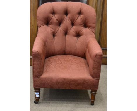 Victorian armchair, circa 1870, recovered in orange floral fabric with button back and sides above and overstuffed seat, rais
