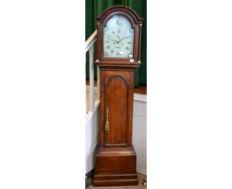 < An oak eight day longcase clock, signed W.Giscard, Ely, circa 1800, arched pediment, 12-inch painted arched dial, seconds a