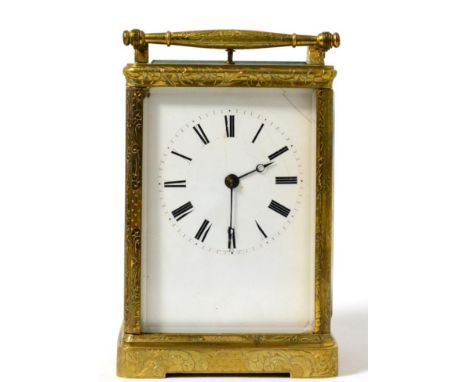 A brass engraved striking and repeating carriage clock, Auguste A Paris, circa 1870, carrying handle and repeat button, ename