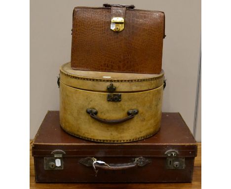 ^ A vintage brown leather briefcase, brown leather suitcase stamped with initials 'KVB', together with a late 19th/early 20th