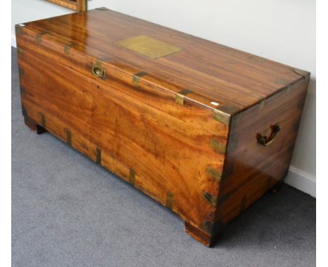 A 19th century camphor wood and brass bound trunk of large proportions, hinged lid and carrying handles, 150cm wide