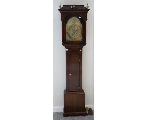 An oak eight day longcase clock, signed Robt Jackson, Guinsborough, circa 1770, caddied pediment, arched trunk door, 12-inch 