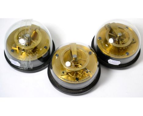 Three clock escapement display models, circa 1920's, ''chronometer escapement'', ''English lever escapement'' and the ''horiz