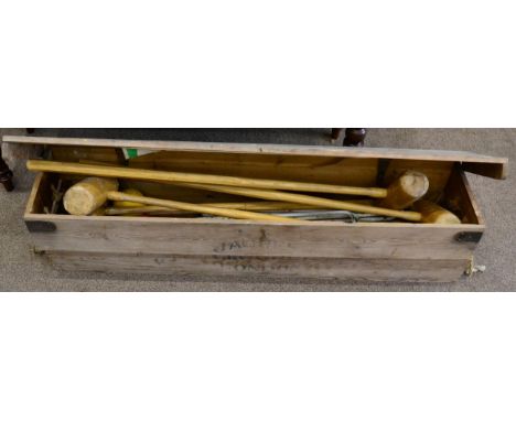 A vintage Jaques croquet set, with hinged lid, enclosing a paper label, four mallets each stamped 'Jaques London', four balls