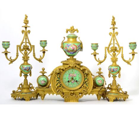 A gilt metal and porcelain mounted striking mantel clock garniture, signed Achille Brocot, circa 1880, surmounted by a urn fi