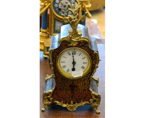 A 19th century Boulle case mantel timepiece, case of cartouche form with floral finial and feet, 32cm high 