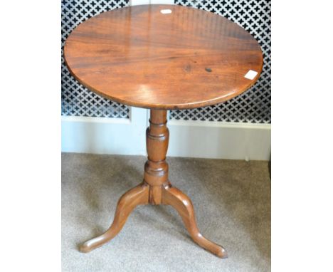 A George III style mahogany piecrust edge tripod table, late 19th century, with the flip top raised on a baluster support, wi