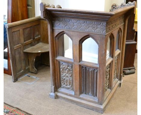 A Victorian carved oak corner lectern, by repute from St Oswald's Church, Hauxwell, North Yorkshire, with Gothic tracery styl
