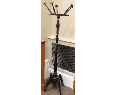 Mahogany spindle turned hat and coat stand, early 20th century, circular top with five arms raised on a baluster support, 178
