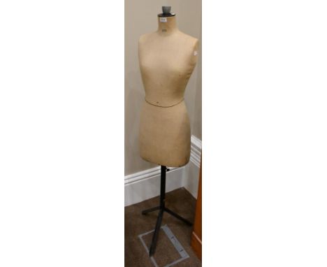 ^ A vintage dressmakers dummy, 1st half 20th century, raised on adjustable black metal tripod stand, 152cm high