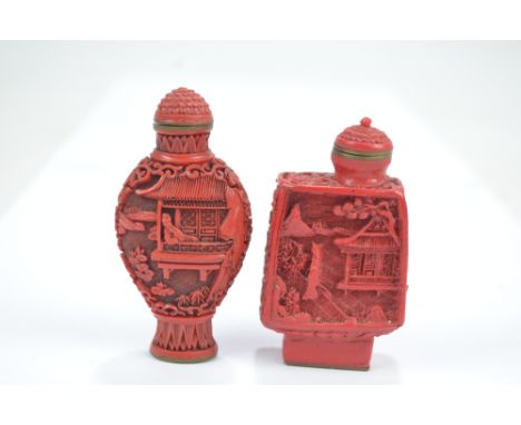 A Chinese cinnabar snuff bottle of flat ovoid form, finely decorated with figural and architectural landscape to each side, o