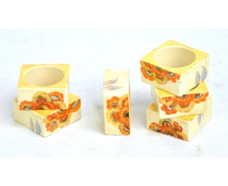 CLARICE CLIFF; a set of six 'Rhodanthe' pattern square sectioned napkin rings, each width 5cm. CONDITION REPORT: Two with sma