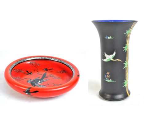 CARLTON WARE; a magpie decorated red ground bowl, printed marks, diameter 27.5cm and a Carlton Ware black stork and bamboo tr