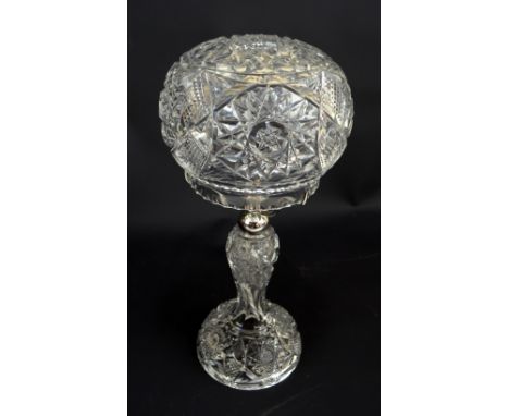 A cut glass 'mushroom' lamp with star detail to the domed shade and spreading foot, height 39cm.