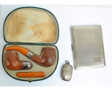 JOHN TAYLOR & CO; an Edward VII hallmarked silver rectangular cigarette case with overall engine turned decoration and vacant