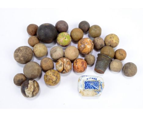 A group of Victorian ceramic marbles.
