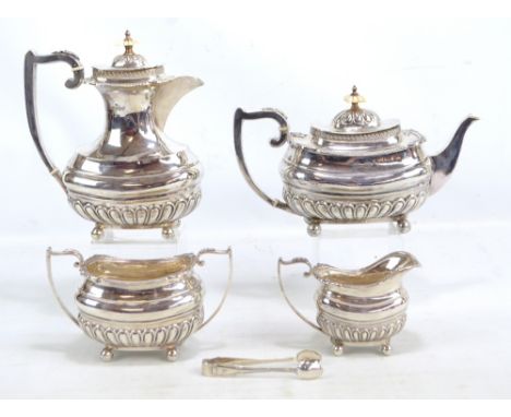 WALKER & HALL; a George VI hallmarked silver four piece set comprising a rounded rectangular teapot with part gadrooned decor