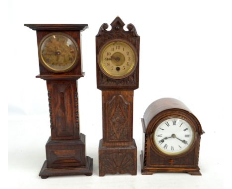 Two oak cased miniature longcase clocks, the dials set with Roman and Arabic numerals respectively, height of slightly taller