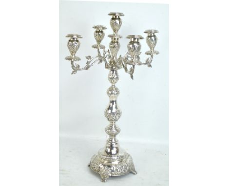 MOSES SALKIND; a large George V hallmarked silver four branch candelabrum with central scone above knopped floral and foliate