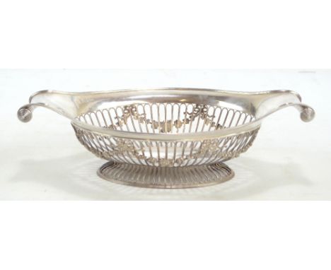 HASELER BROS; an Edward VII hallmarked silver shaped oval dish with twin scrolling handles and garland decorated open work si