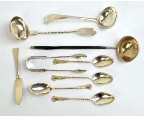 A mixed group of silver including two ladles, four coffee spoons, a small butter knife, a pair of sugar tongs and an unmarked