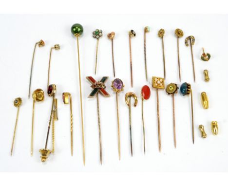 A collection of stick pins including a Scottish hardstone example, diamond set example, rosebud example, horse shoes, etc.