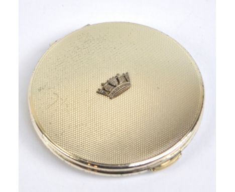 KIGU LTD; an Elizabeth II hallmarked silver engine turned decorated circular powder compact, London 1965, diameter 7cm.