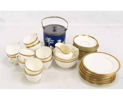 A Paragon gilt decorated twelve setting tea service comprising trios (one cup missing), a cream jug and a sugar bowl, also a 
