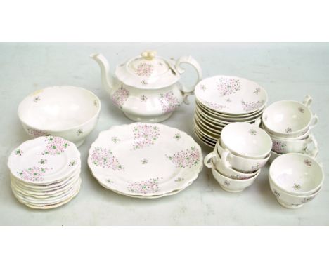 A 19th century stylised floral decorated twelve setting part tea service, probably Ridgway. CONDITION REPORT: Teapot lid af, 