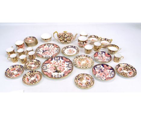 A set of six Royal Crown Derby Imari pattern no.2451 coffee cans with saucers, an oval teapot, a circular sugar bowl, two var