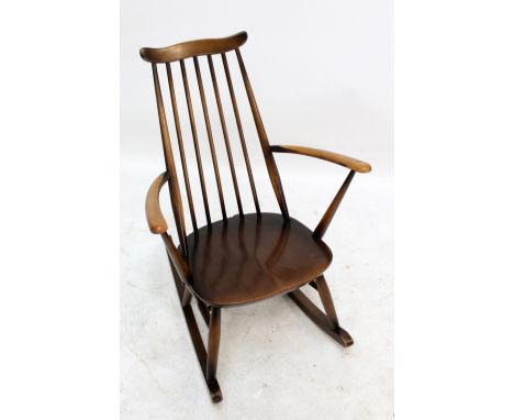 An Ercol stick back rocking chair. 