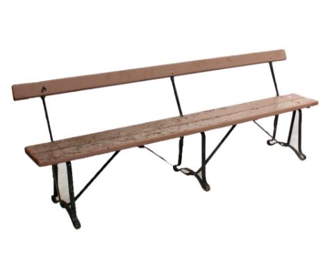A cast iron bench, width approx 230cm. CONDITION REPORT: Heavily weathered and worn throughout, flaking paint, will need sign