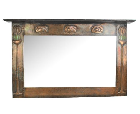 A good and large Edwardian Arts and Crafts beaten copper overmantel mirror with stylised tree design in green Ruskin inset ro