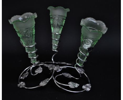A light green glass three branch epergne with moulded floral decoration in electroplated tendril and leaf decorated frame, he