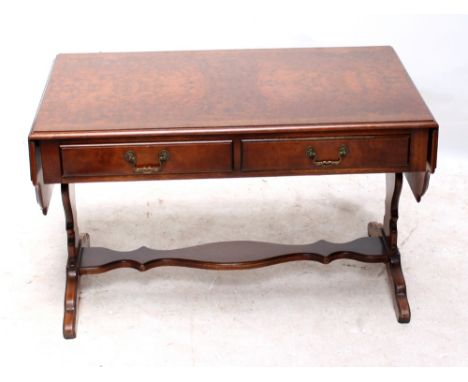 A reproduction burr walnut cross banded low sofa table.