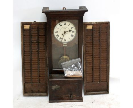 GLEDHILL-BROOK TIME RECORDER CO LTD; an early 20th century clocking in clock, no.94979, complete with in and out card boards 