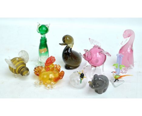 Three Hot Mark's hand blown glass figures of cockerel, winged pig and bumblebee, a spill vase modelled as a bird beneath leav