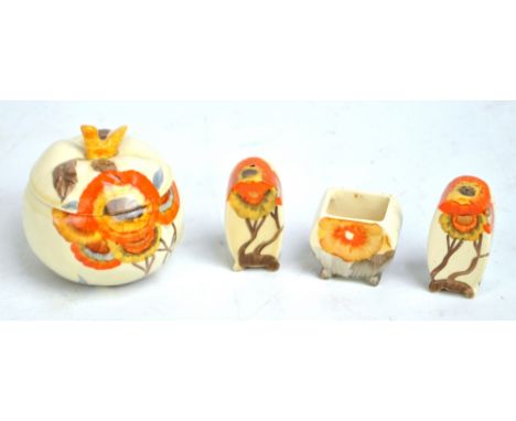 CLARICE CLIFF; a three piece 'Rhodanthe' pattern cruet set (mustard lacking lid), and an apple shaped preserve pot and cover 
