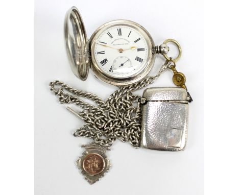 A .935 grade silver full hunter key wind pocket watch, the outer case engraved with initials enclosing a white enamel dial in