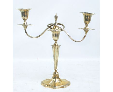 WALKER & HALL; a George V hallmarked silver candelabrum with entwined twin branches on shaped oval tapering stem and spreadin
