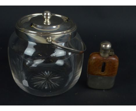 A George V hallmarked silver mounted and clear glass biscuit barrel, Sheffield 1915, and a small silver mounted hip flask (2)