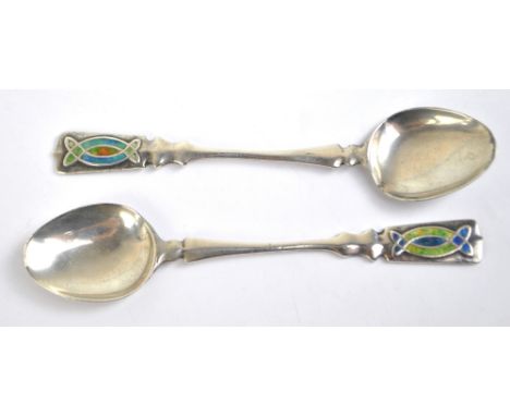 A pair of Arts and Crafts Edwardian hallmarked silver and enamel decorated coffee spoons, makers marks obscured, Birmingham 1