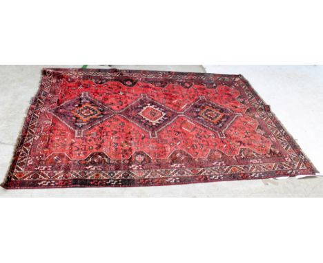 A modern Iranian handmade woollen red/blue ground carpet by Tribal Rugs Ltd, 300 x 212cm.