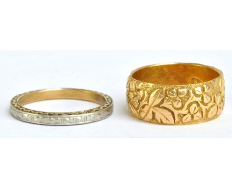 An 18ct yellow gold wedding band with engraved floral decoration, size J/J1/2, and an 18ct yellow gold and platinum example, 
